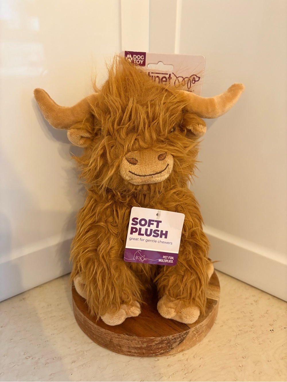 Multipet Highland Cow Plush Dog Toy with shaggy brown fur.